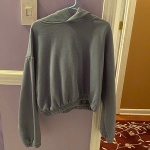 Blue cropped hoodie by refugee athletics